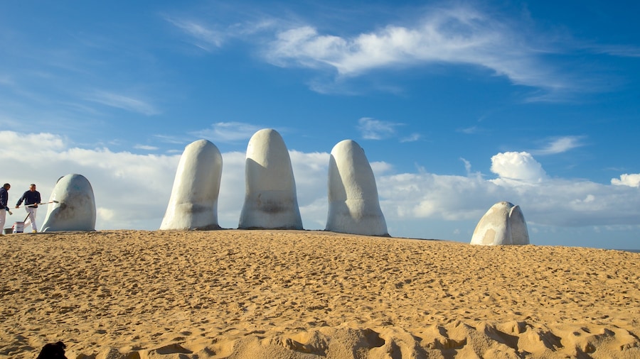 Brava Beach which includes a statue or sculpture, general coastal views and outdoor art