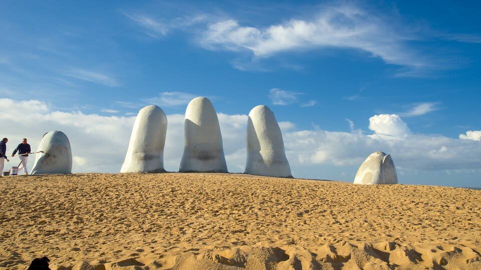 A desert landscape with large white rock formations.