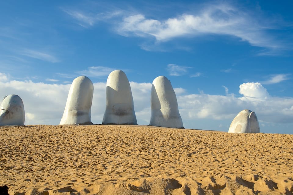 A desert landscape with large white rock formations.