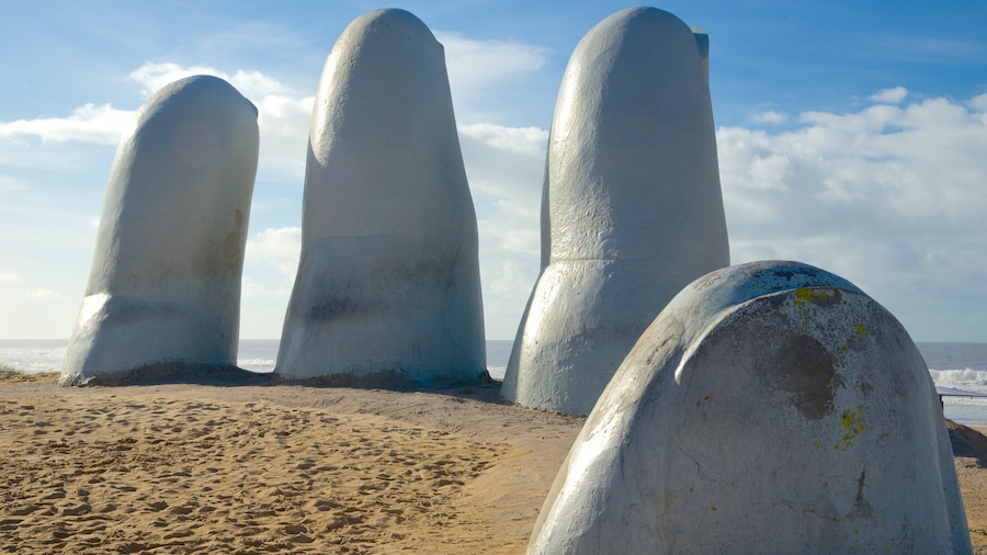 Brava Beach showing general coastal views, outdoor art and a statue or sculpture