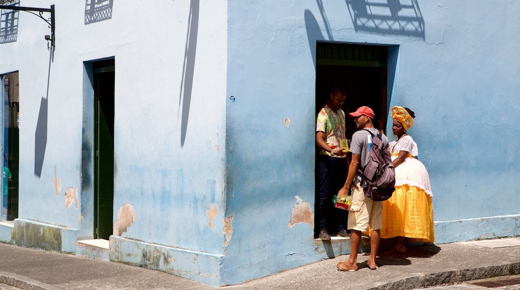 Pelourinho showing a house and street scenes as well as a small group of people