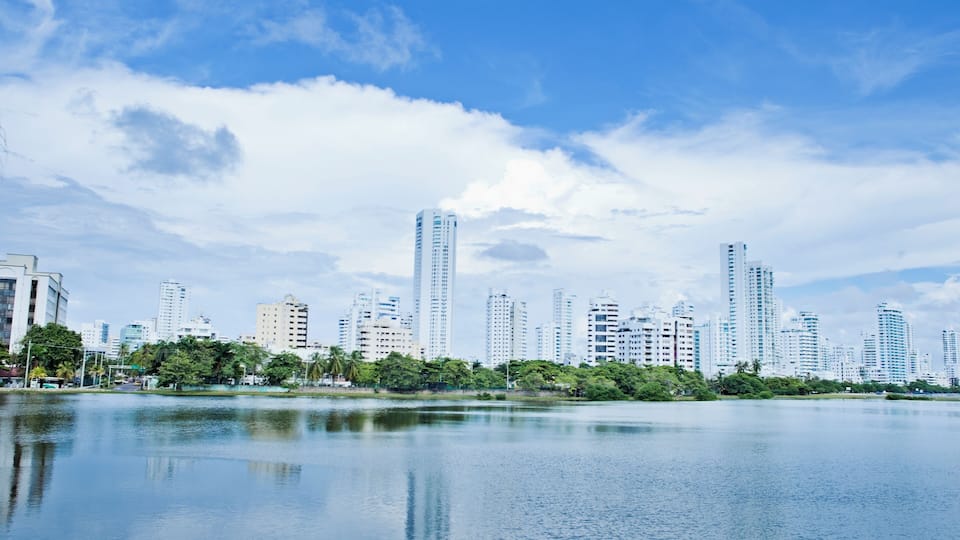 "Colombia, Bolivar, Cartagena De Indias, El Laguito, Bocagrande appartments reflecting in lagoon"