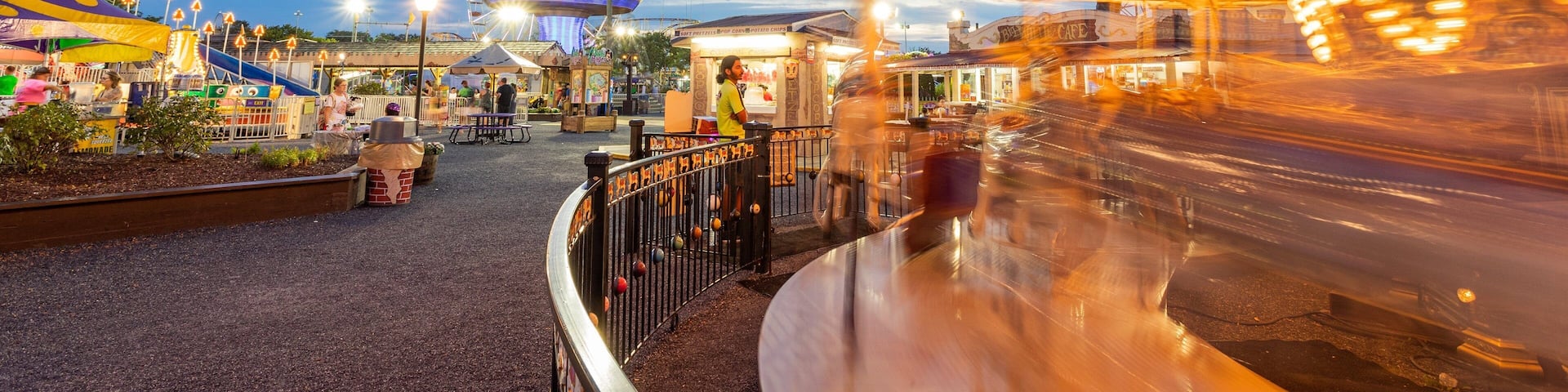 Jolly Roger Amusement Park which includes night scenes and rides