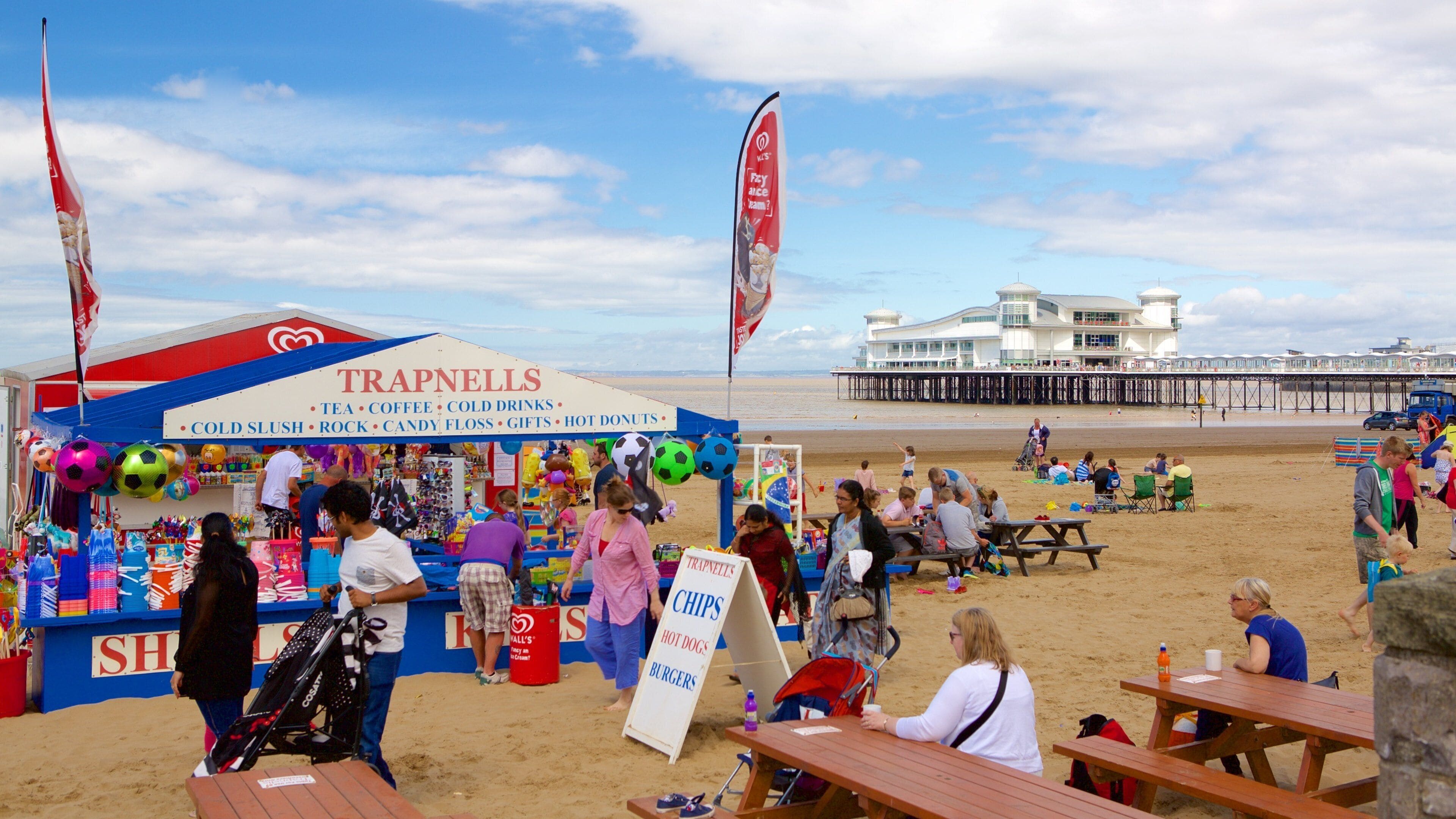 The Grand Pier which includes a beach, outdoor eating and café lifestyle