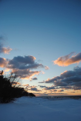 February isn't the best time to go to the beach in Buffalo NY, but you get a different kind of vibe from the beach when it's covered in 3ft of snow and the icy water splashing against the forming icebergs. 
Blue and Orange were being perfectly contrasted in the sky and on the land. It was a beautiful sunset and I was so happy that i was able to capture this moment. 
Buffalo NY isn't where you are going to get your perfect paradise tropical photos, but standing on the snow covered beach, watching the sunset on the land, that was paradise to me. 
#BeachBound
#Beach #Winter #snow