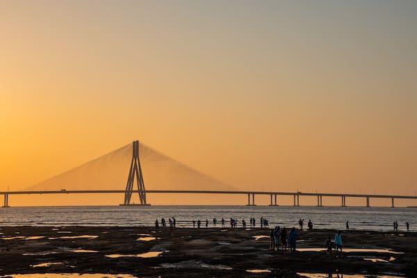 Bandra-Worli Sea Link showing a sunset, a bridge and a river or creek