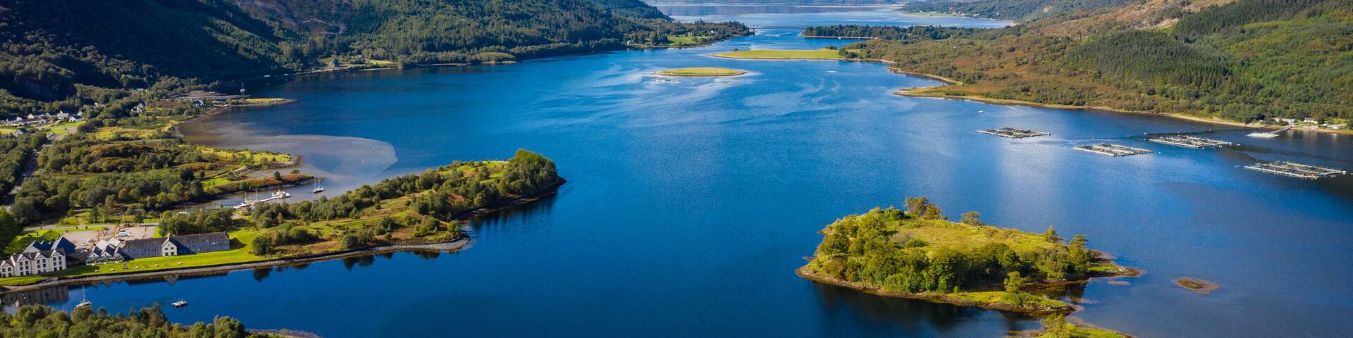 aerial view of loch linnhe in summer near duror and ballachulish and glencoe in the argyll region of the highlands of scotland showing blue water and green fertile coast line