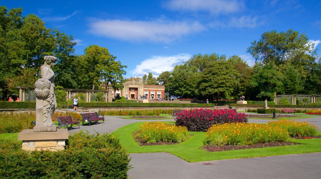 Stanley Park which includes a garden, wild flowers and a statue or sculpture