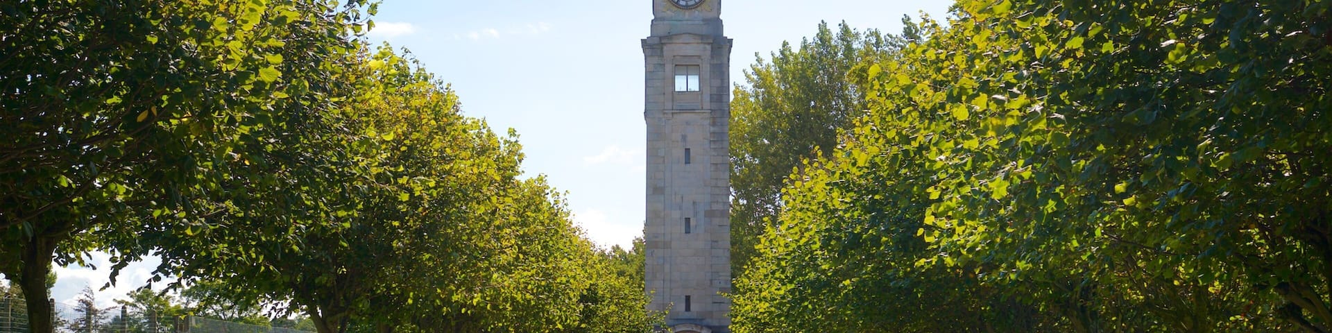 Stanley Park featuring a park and heritage architecture as well as a small group of people