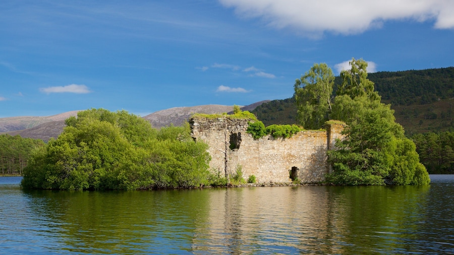 Loch an Eilein featuring a river or creek, mountains and island images
