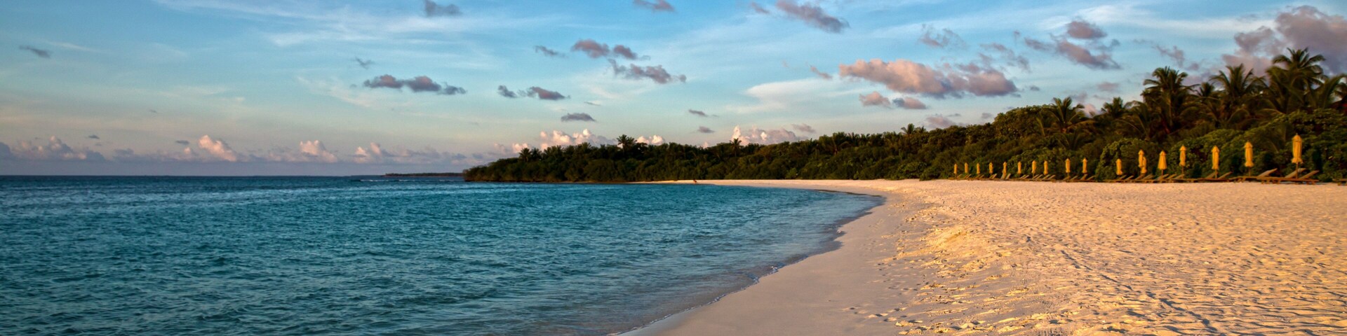 parasol and chairs on the beach of hanimaadhoo (maldives)