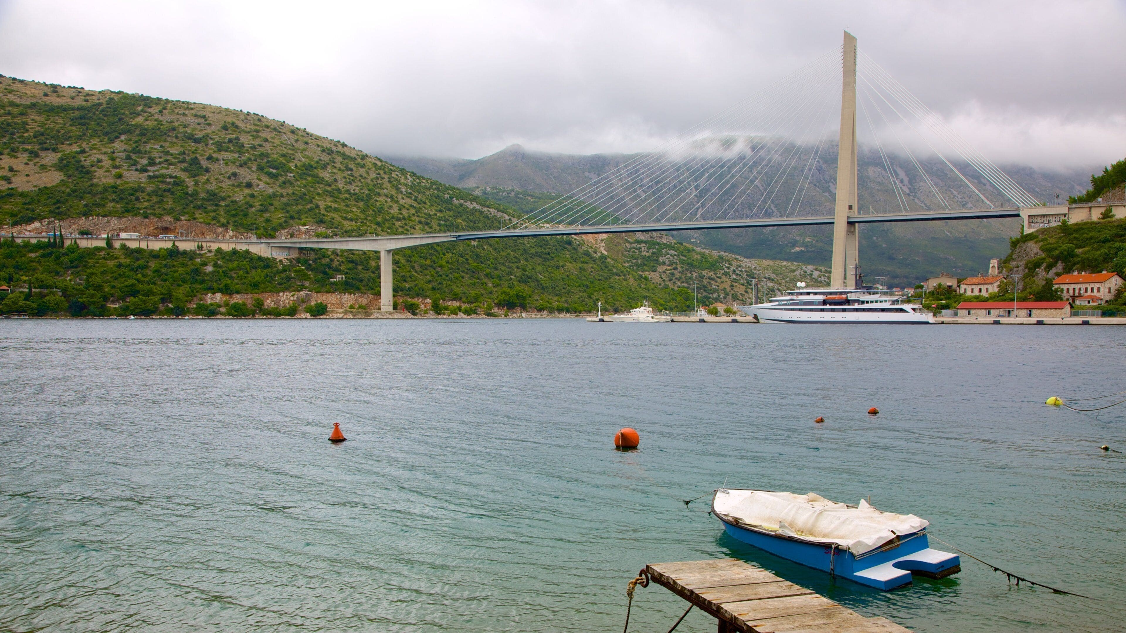 Lapad showing a bay or harbor and a bridge