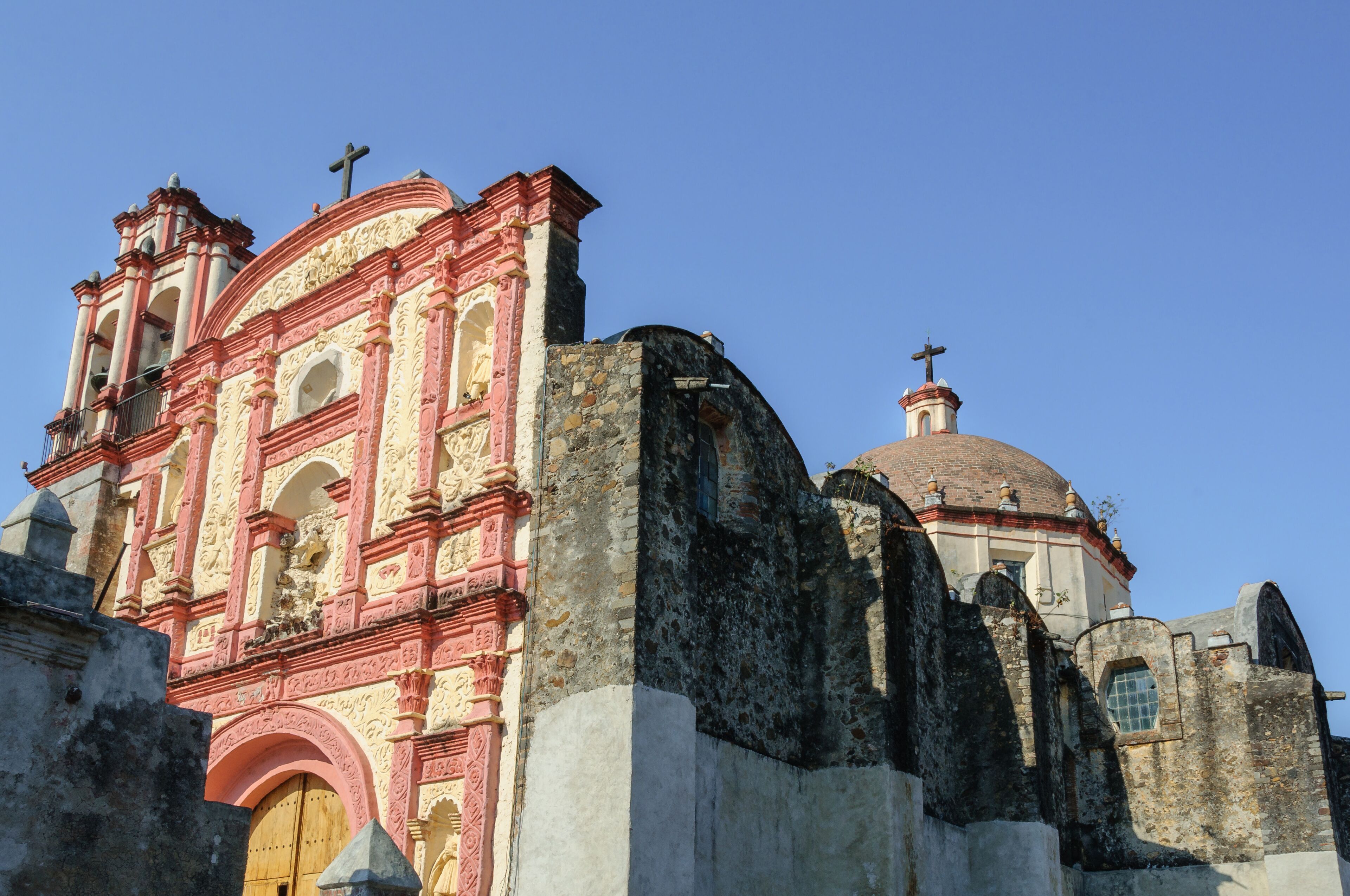 A historic church with intricate architecture, a prominent bell tower, and a dome.