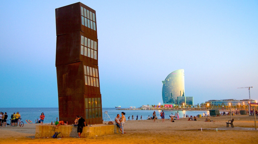 Barceloneta Beach showing modern architecture, a sandy beach and outdoor art