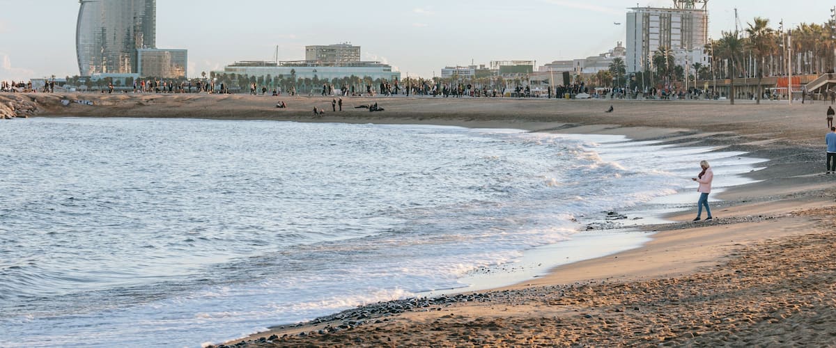 Barceloneta Beach which includes general coastal views, a beach and a coastal town