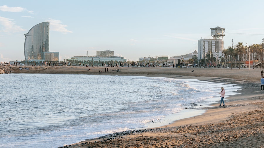 Barceloneta Beach which includes general coastal views, a beach and a coastal town