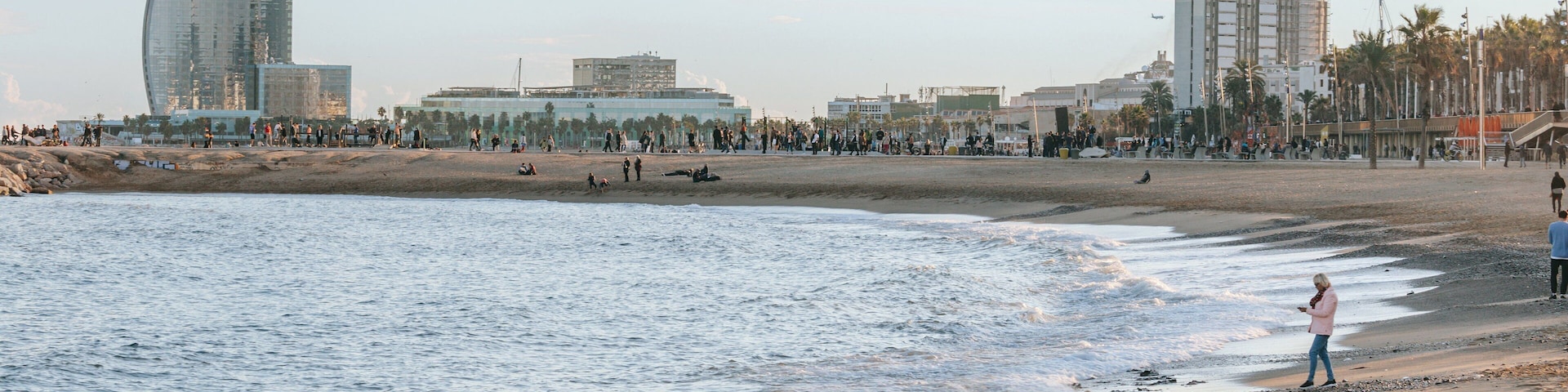 Barceloneta Beach which includes general coastal views, a beach and a coastal town
