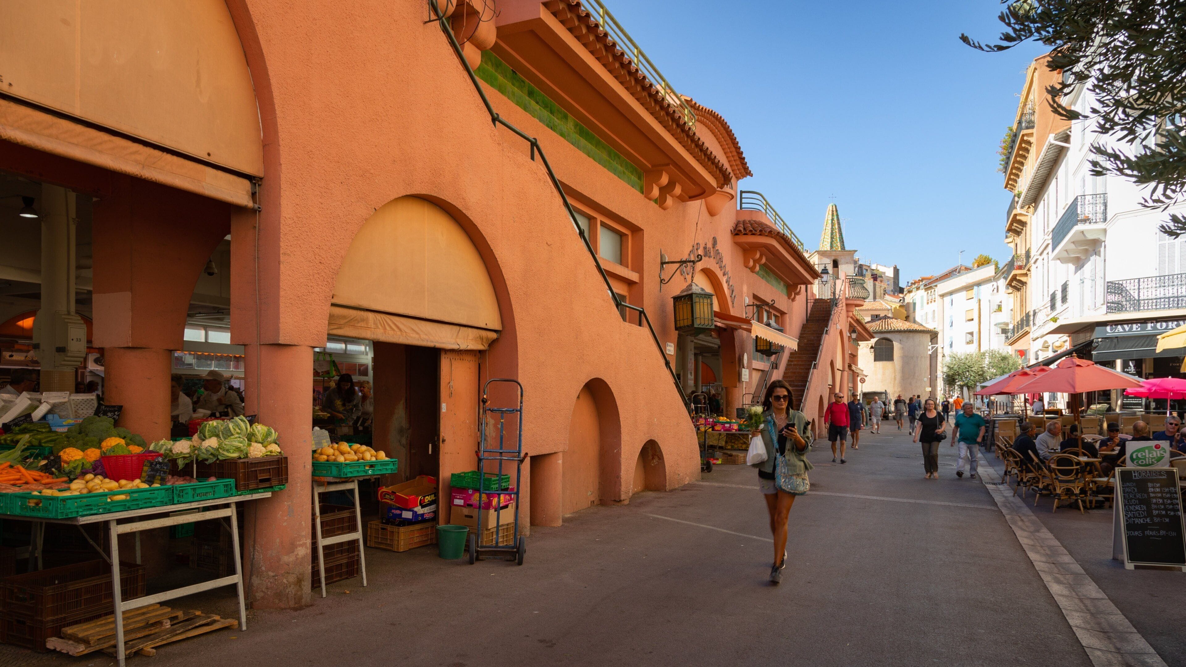 Forville Provencal Food Market showing street scenes as well as an individual femail