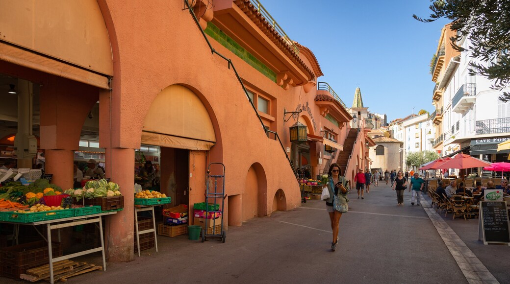 Forville Provencal Food Market showing street scenes as well as an individual femail