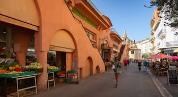 Forville Provencal Food Market showing street scenes as well as an individual femail