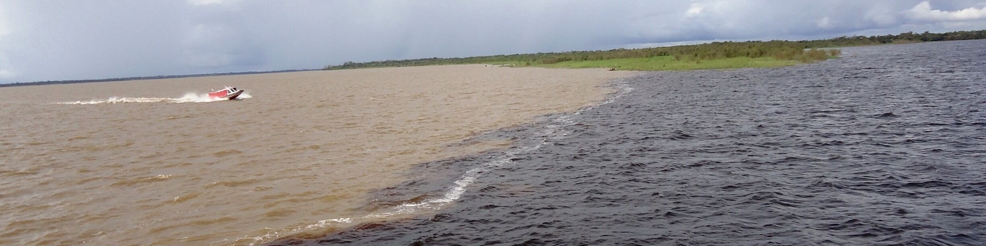 In Manaus, Brazil, the Amazon River and the Rio Negro merge. The Amazon is the sandy colored water, and the Rio Negro is the dark colored water. For almost 4 miles the two rivers run side by side without mixing. It's one of those things you almost have to see to believe. I saw it with my own two blue eyes, so I do believe!!