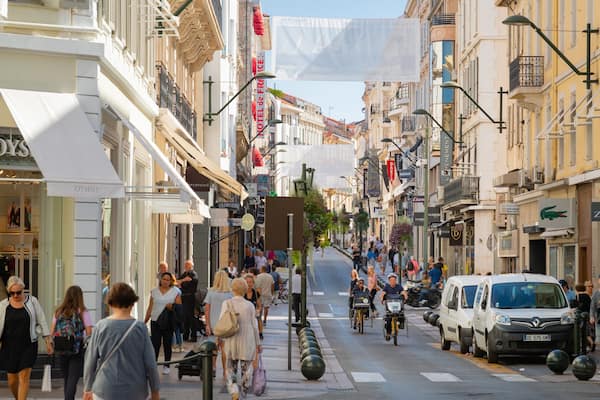 Rue d\'Antibes featuring street scenes and a city as well as a small group of people