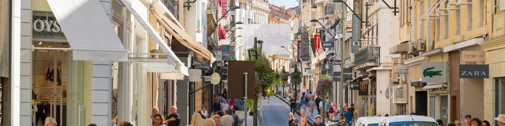 Rue d\'Antibes featuring street scenes and a city as well as a small group of people