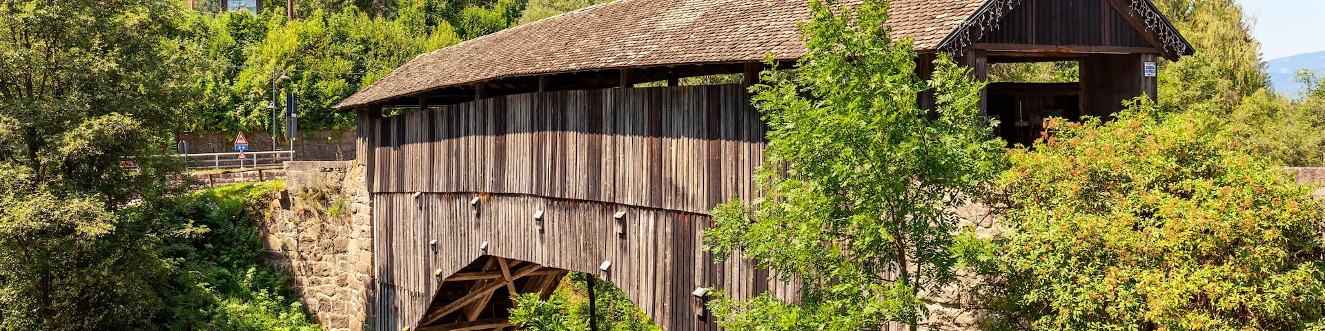 old wooden bridge in ziano di fiemme