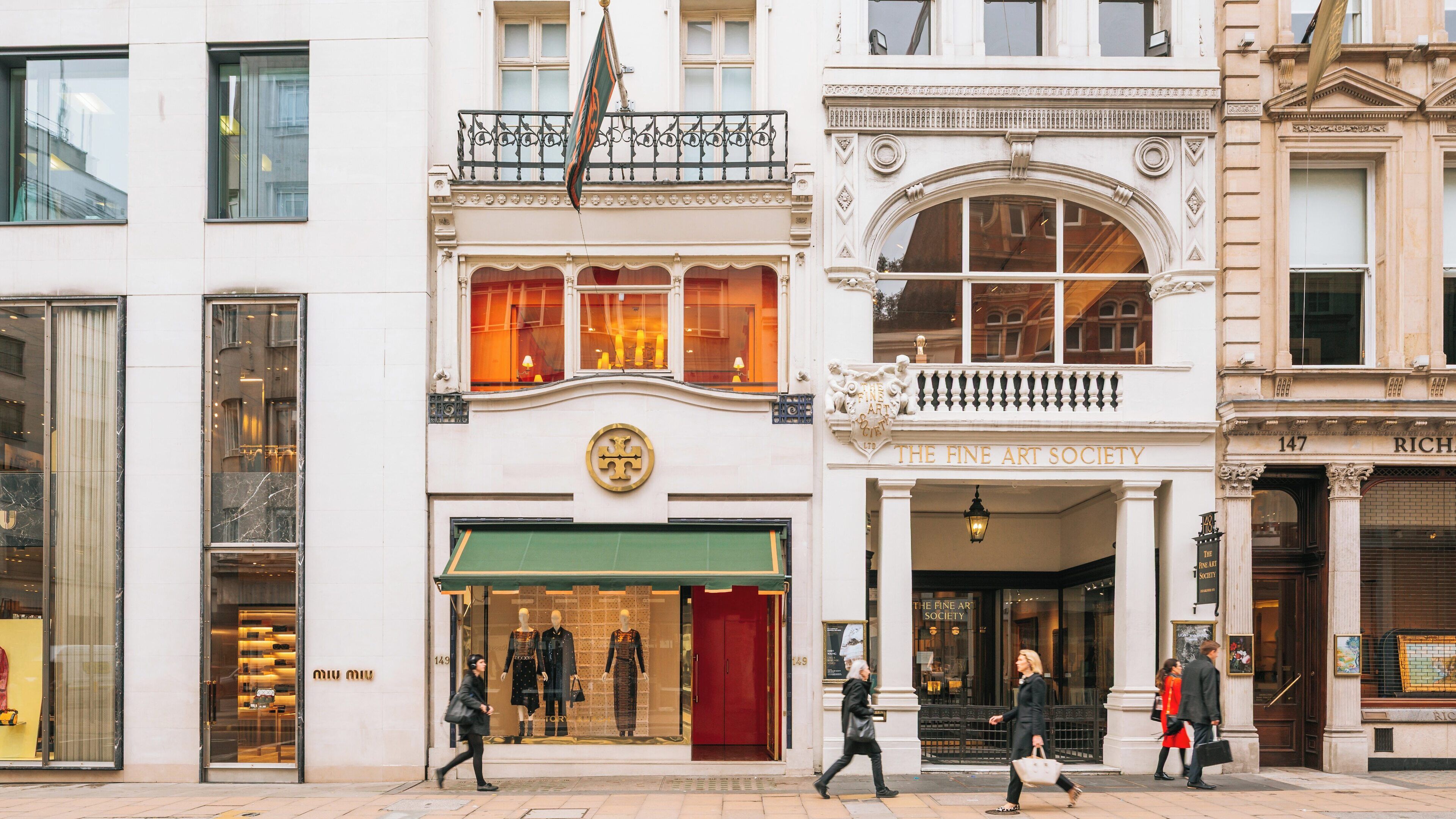 Exploring Bond Street, a vibrant shopping destination in the heart of London City Centre, showcasing elegant architecture and bustling pedestrians