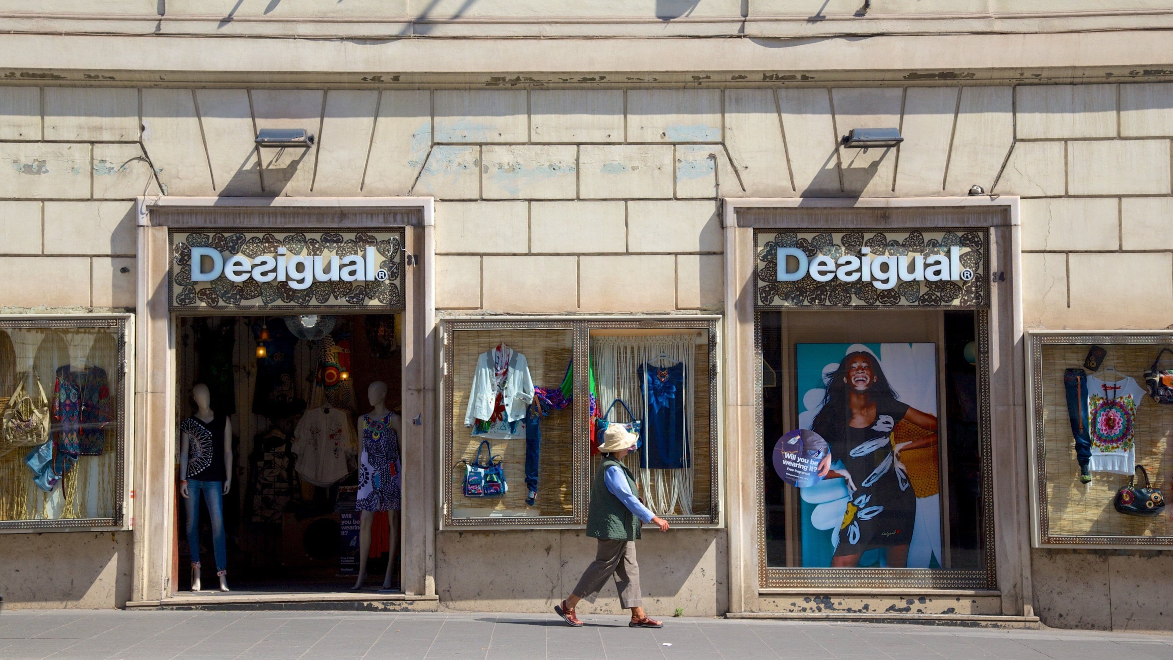 Via Nazionale which includes shopping, street scenes and a city