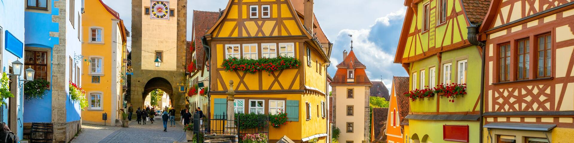 A sunny day at the picturesque Plonlein Little Square and Siebersturm clock tower, at the village of Rothenburg ob der Tauber, Germany, the famous stop along the Romantic Road drive through Bavaria.