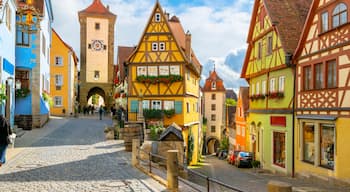 A sunny day at the picturesque Plonlein Little Square and Siebersturm clock tower, at the village of Rothenburg ob der Tauber, Germany, the famous stop along the Romantic Road drive through Bavaria.