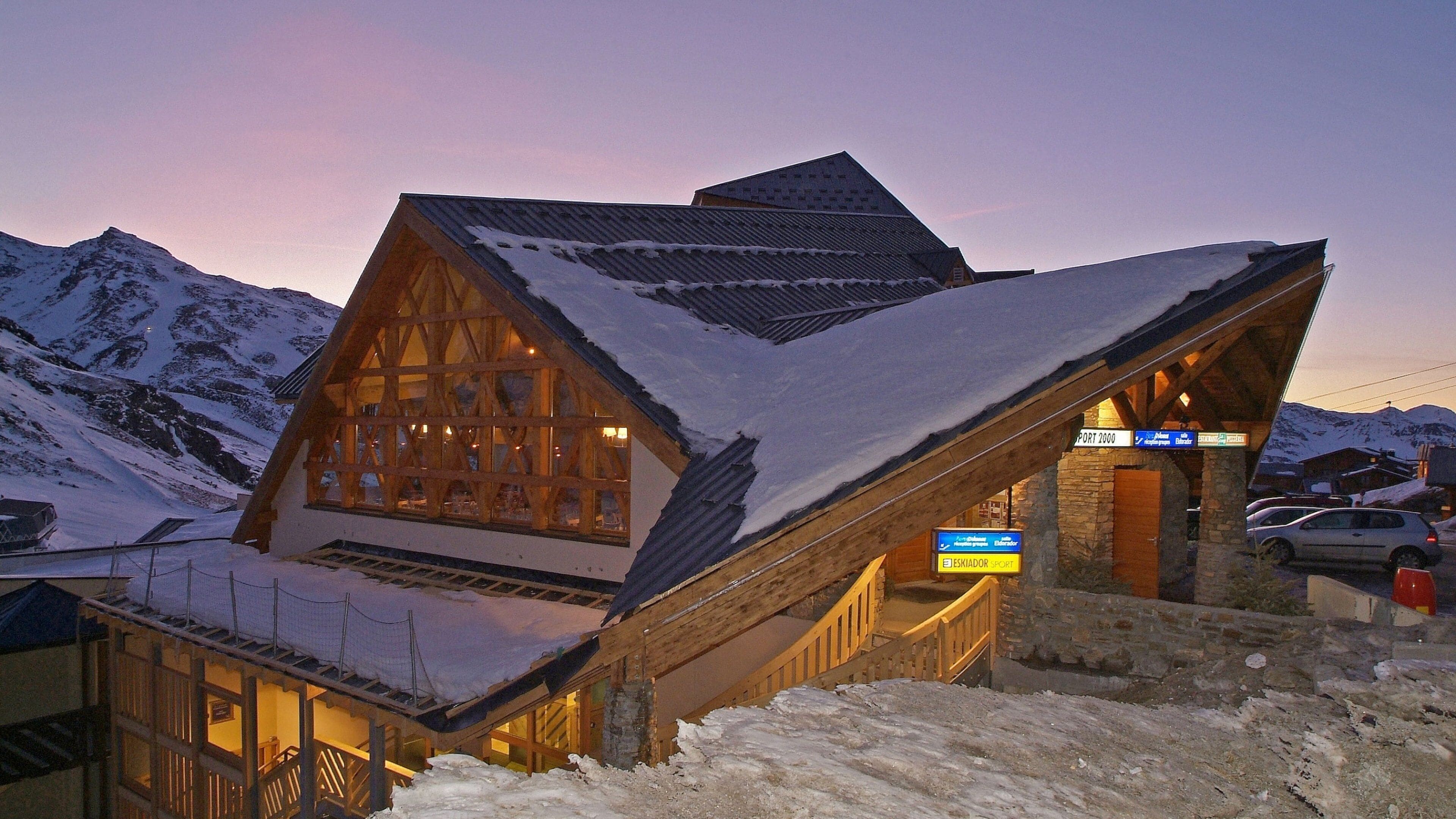 Val Thorens Ski Resort showing a sunset, snow and a luxury hotel or resort