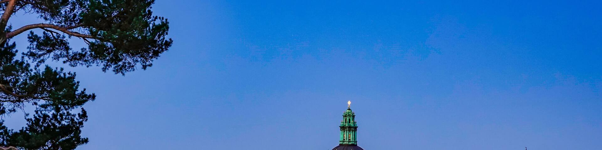 Stockholm, Sweden The rooftops of Kungsholmen at dawn and the church at Odenplan, Gustav Vasa Church