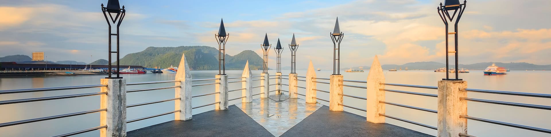 Metal fences on jetty sea view during sunset at Langkawi Island, Malaysia. Long exposure / motion photography.