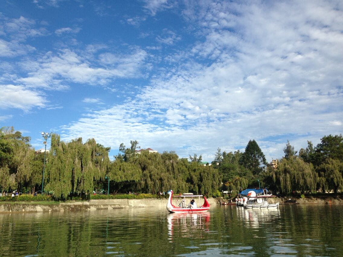 A man made lake in the middle of the park where you can go boating, or savor in the beautiful surroundings, enjoy the flowers, go biking and have a picnic with your family..