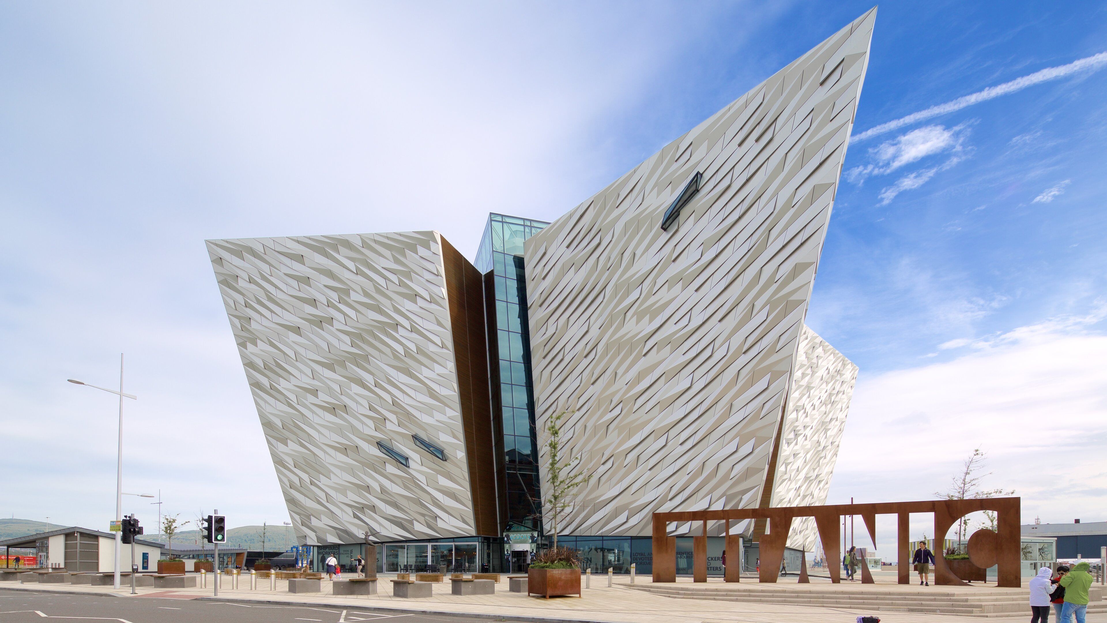 Titanic Belfast featuring street scenes, signage and modern architecture