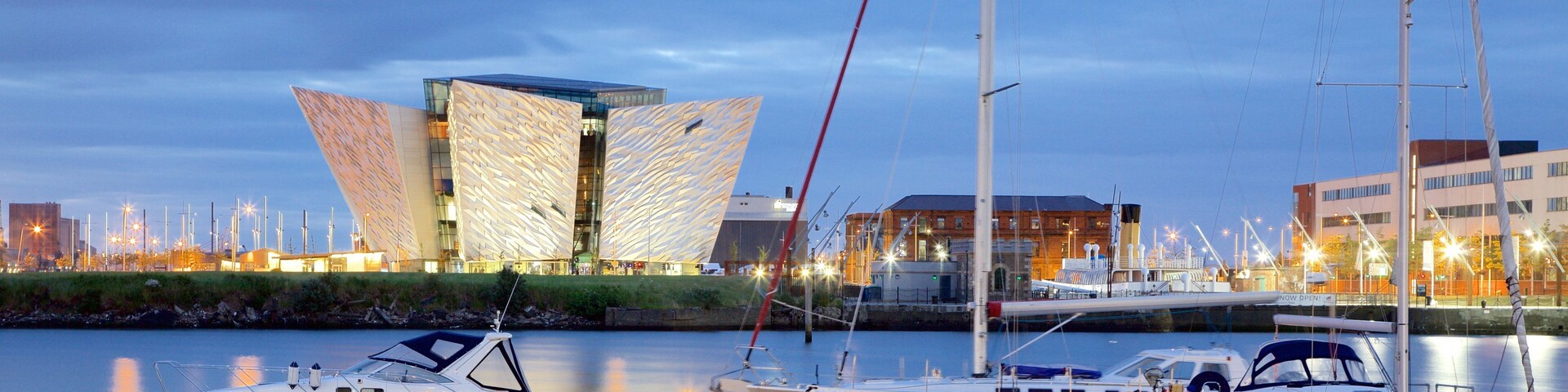 Titanic Belfast featuring modern architecture, a river or creek and a marina