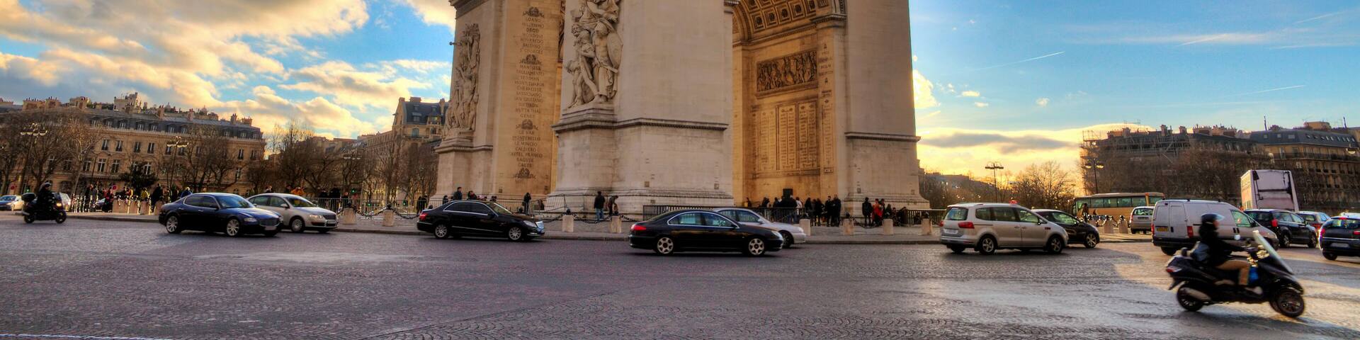 Beautiful view of the Arc de Triomphe at sunset in Paris, France