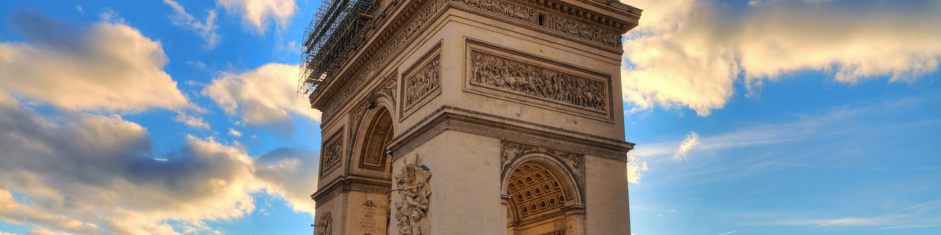 Beautiful view of the Arc de Triomphe at sunset in Paris, France