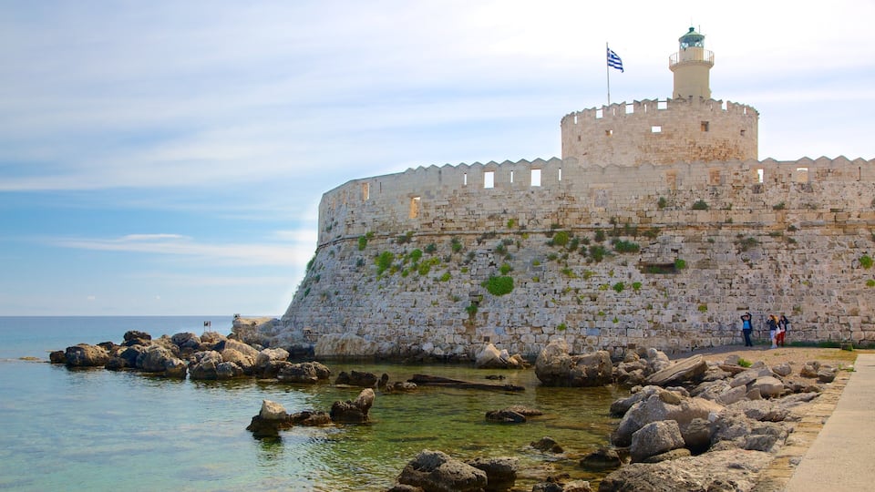 Rhodes featuring rocky coastline, chateau or palace and heritage architecture