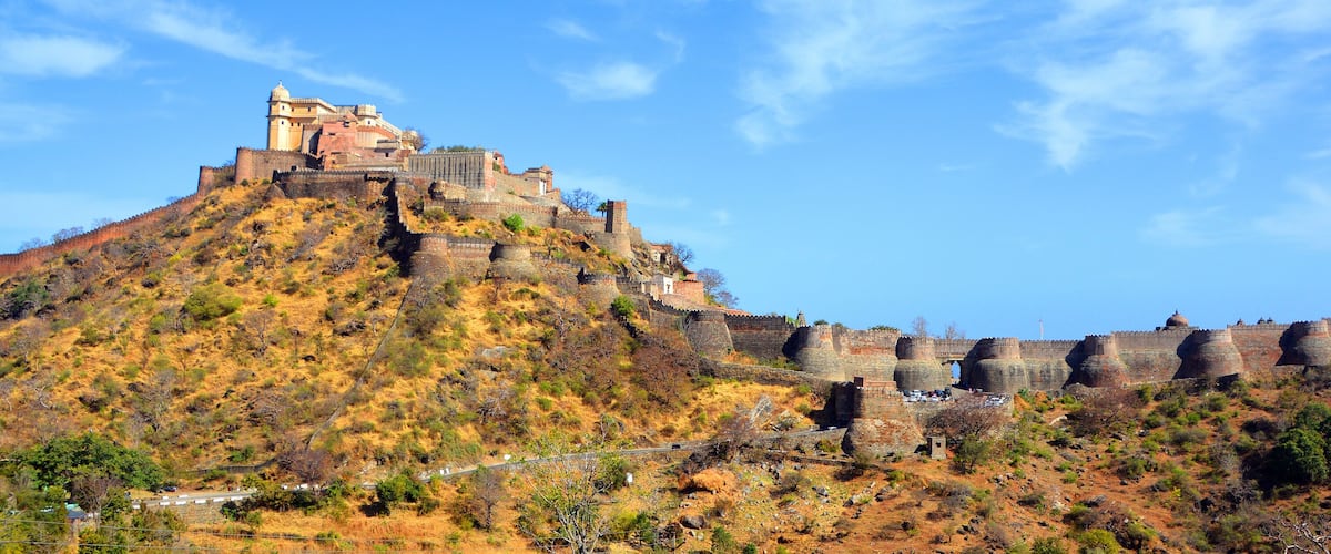 A historic fort on a hill with a clear sky.