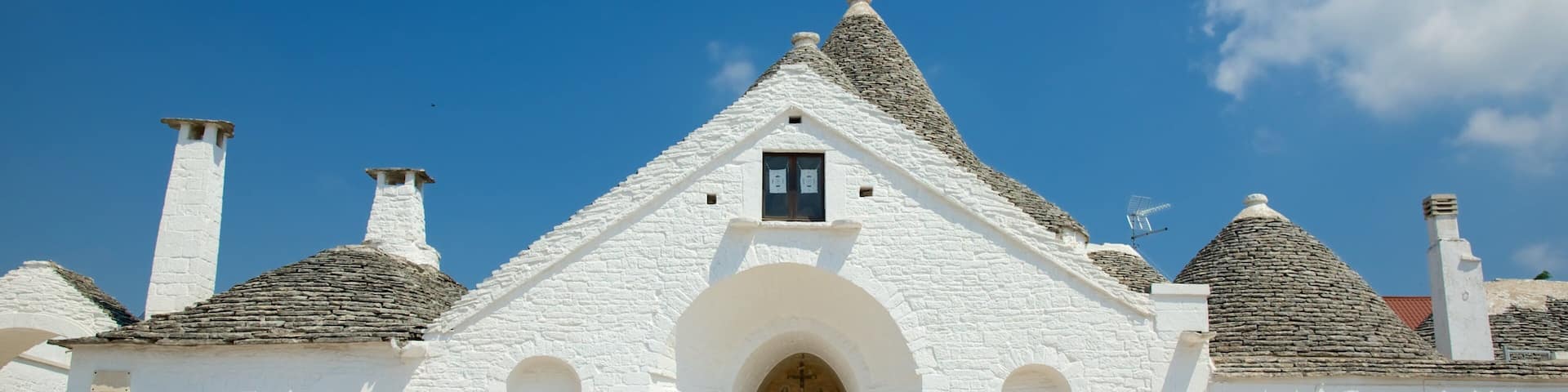 Trullo Sovrano featuring heritage architecture and a city