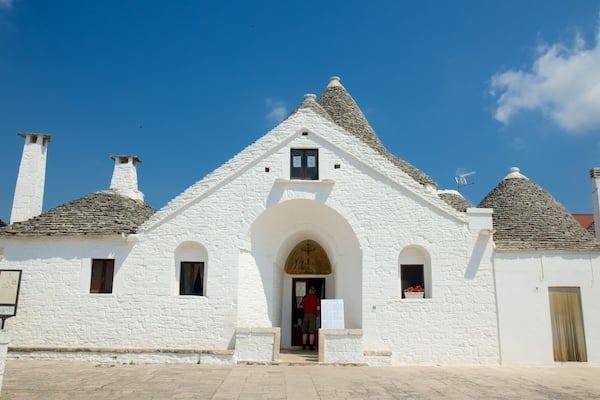 Trullo Sovrano featuring heritage architecture and a city
