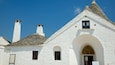 Trullo Sovrano showing heritage architecture and a house