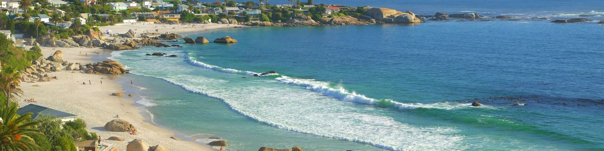 Clifton Bay Beach which includes a coastal town and a sandy beach