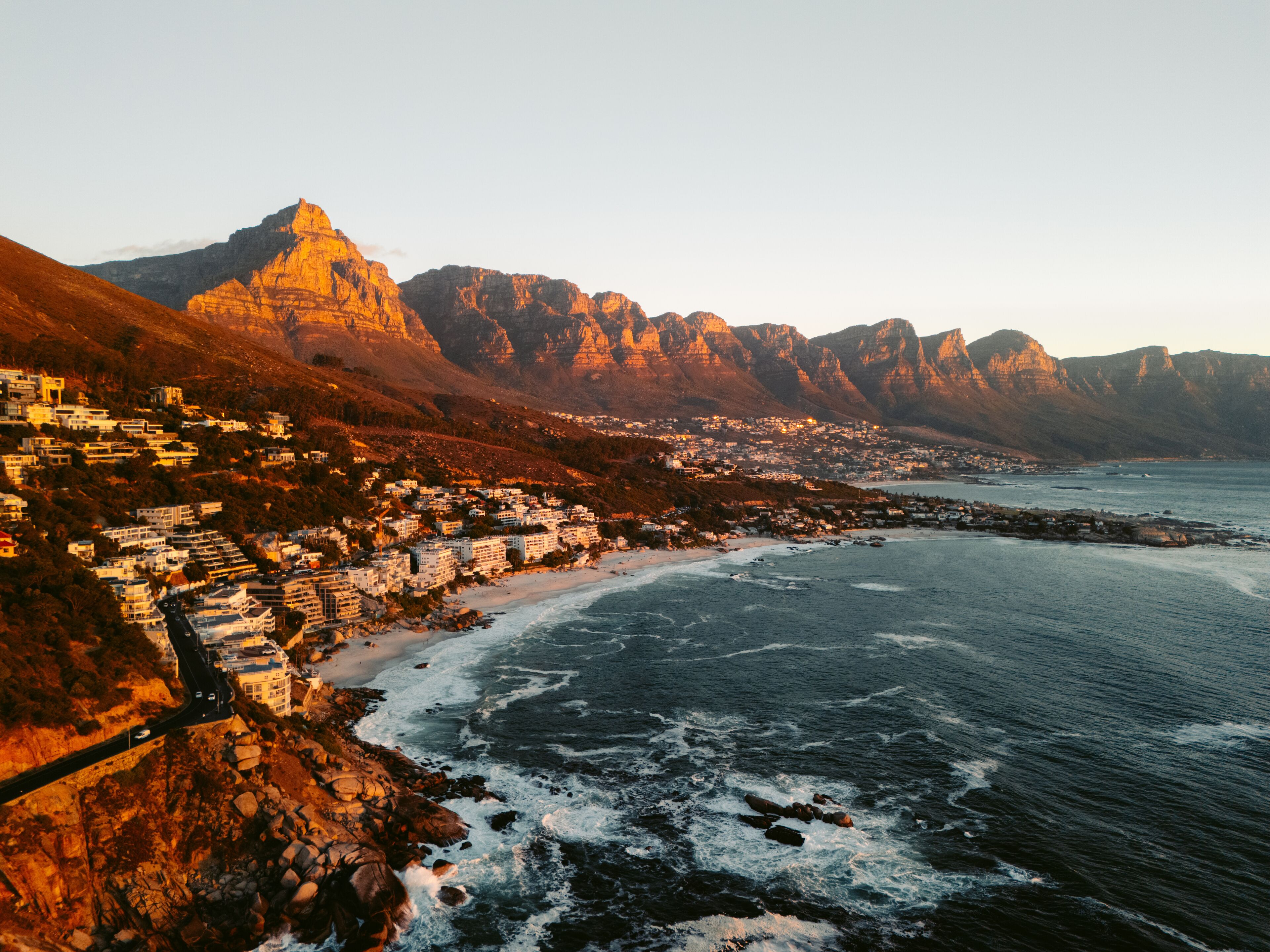 Aerial View of Camps Bay, Cape Town at Sunset with Mountain Backdrop