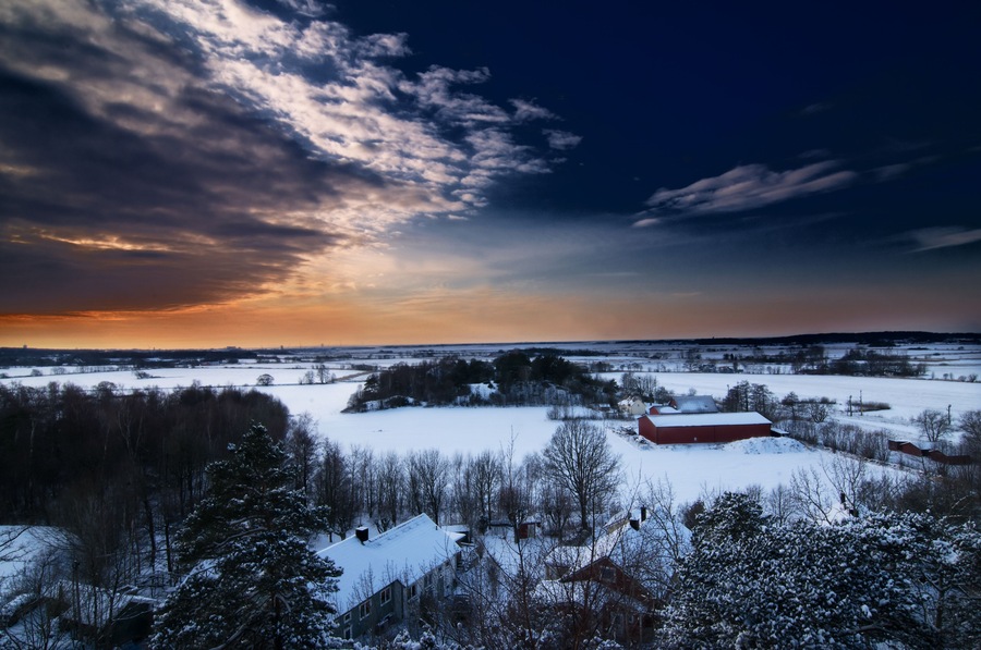 A really beautiful scenery of a winter landscape in the rural parts of Varberg in Sweden shot from above a cliff