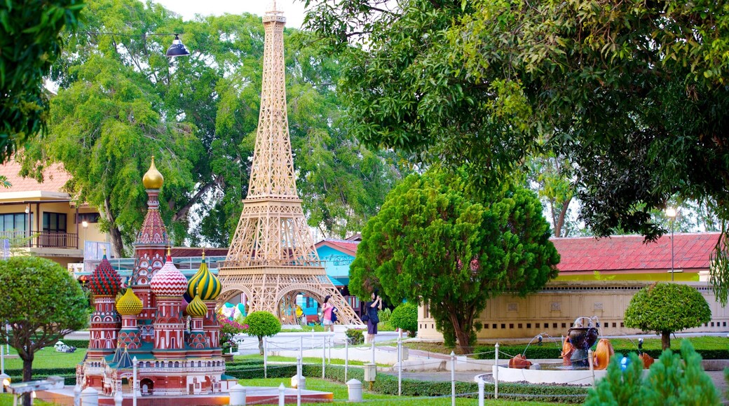 Mini Siam showing rides, outdoor art and a park