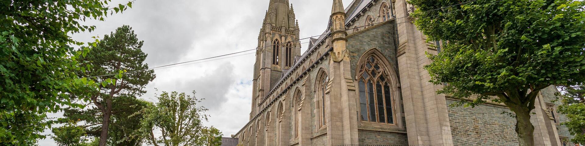 A historic church with tall spires and intricate stonework.